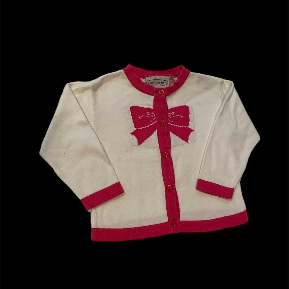 Adorable Toddler White CottonSweater with Pink Accents.